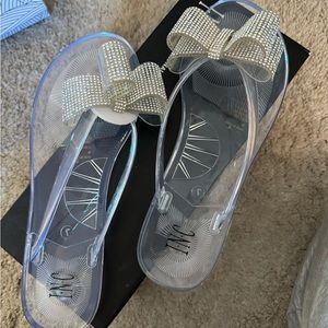 INC sandals. Clear with rhinestone bows